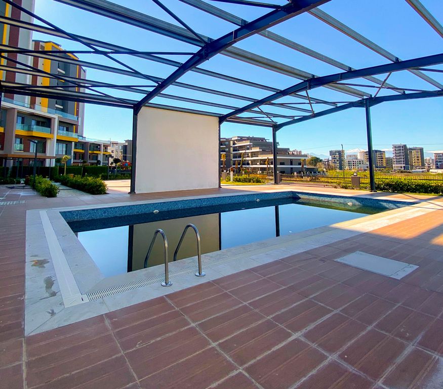 Property photo 3 of 20 Versatile One-Bedroom Apartment For Sale In Antalya - Several Communal Swimming Pools