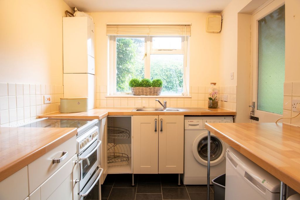 Property photo 2 of 8 Bright Galley-Style Kitchen With Wooden Worktops, ...