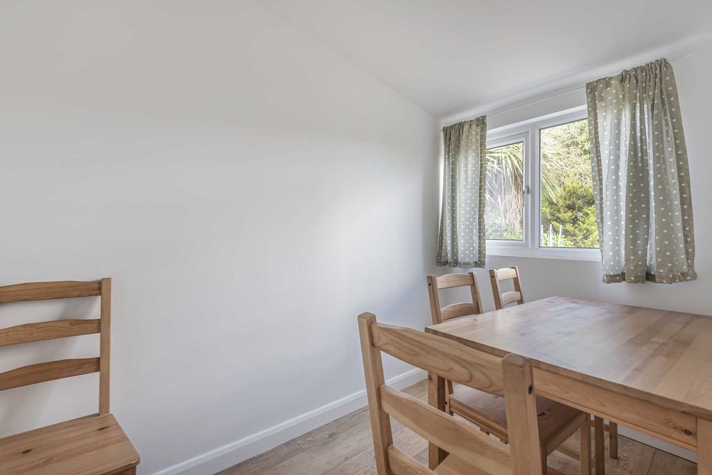 Property photo 1 of 7 Bright Dining Area With A Wooden Table And Chairs ...