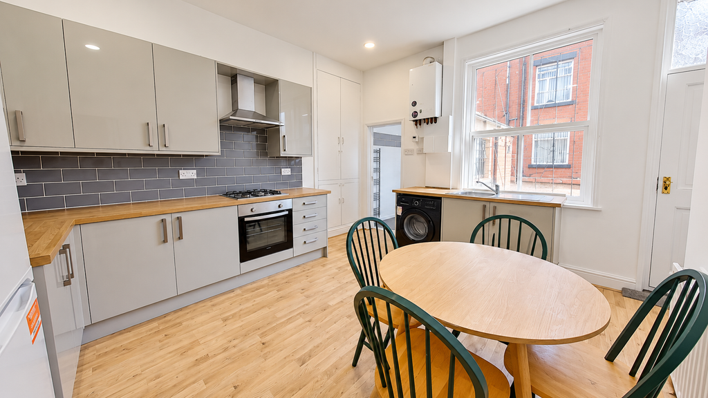 Property photo 1 of 10 Modern Kitchen With Green Dining Chairs
