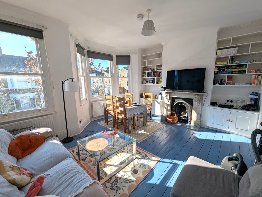 Property photo 1 of 8 Bright Living Room