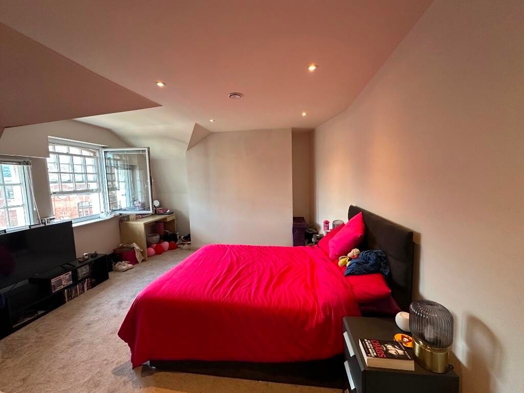 Property photo 2 of 10 A Spacious And Inviting Master Bedroom Featuring A...
