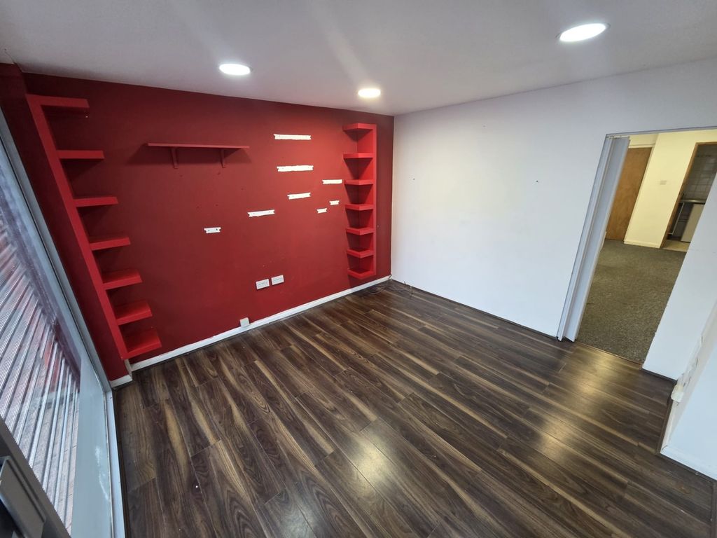 Property photo 2 of 8 Modern Lounge With Feature Wall And Wood Floors...