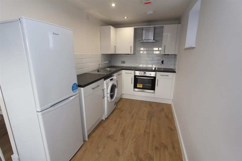 Property photo 2 of 9 Modern Kitchen With Sleek White Cabinets...