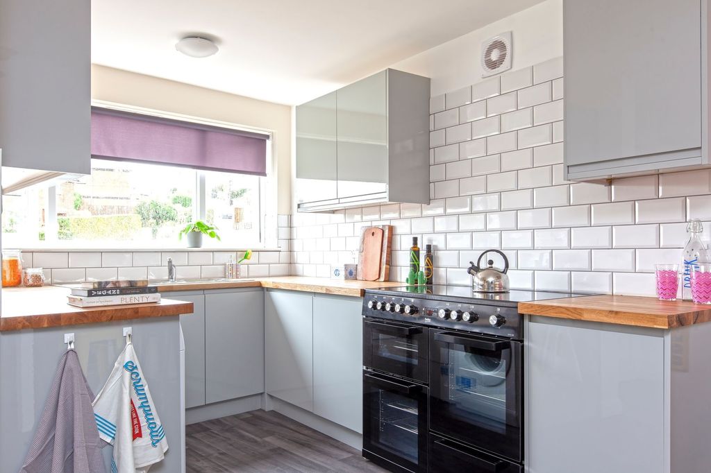 Property photo 1 of 4 This Modern Kitchen Features Sleek Cabinetry, Ampl...