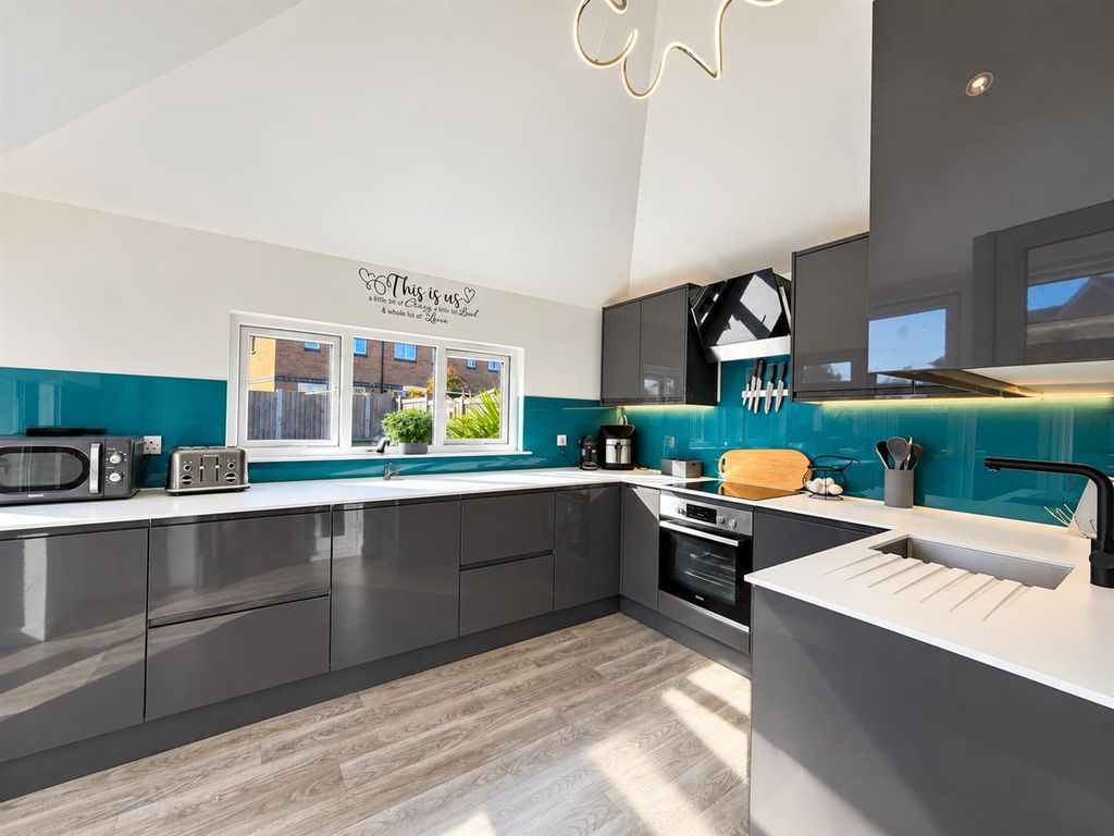 Property photo 3 of 13 Bright Contemporary Teal-Accented Kitchen.Png