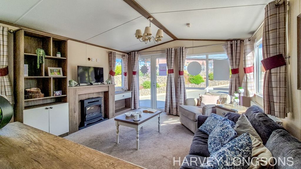 Property photo 3 of 19 Bright Lounge With Patio Doors And Seating.