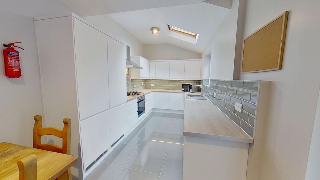 Property photo 2 of 9 Modern, Bright Kitchen With Sleek White Cabinetry,...