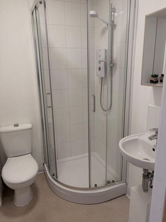 Property photo 3 of 5 Bright, Modern Bathroom With A Curved Glass Shower...