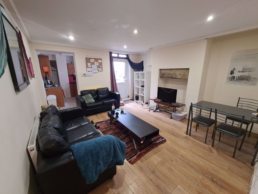 Property photo 2 of 12 A Bright And Welcoming Living Room Featuring A Com...