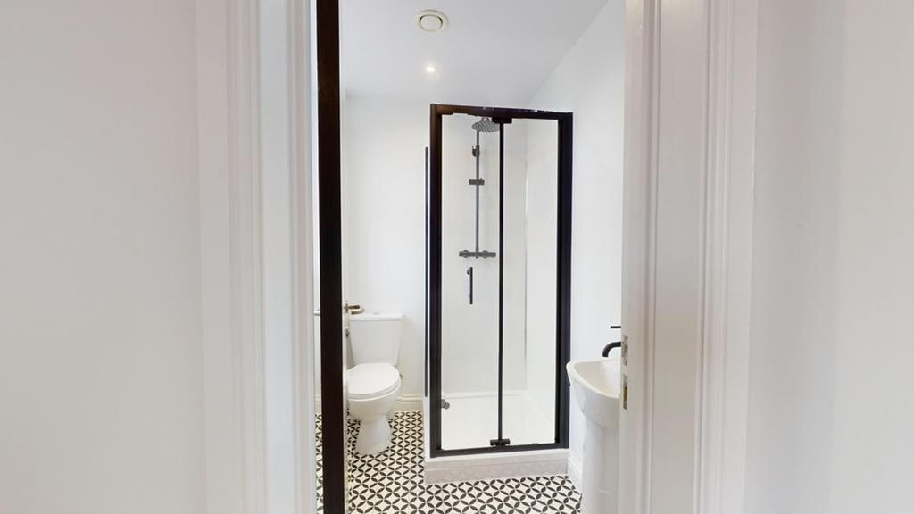 Property photo 3 of 18 A Stylish And Modern Bathroom Featuring A Spacious...