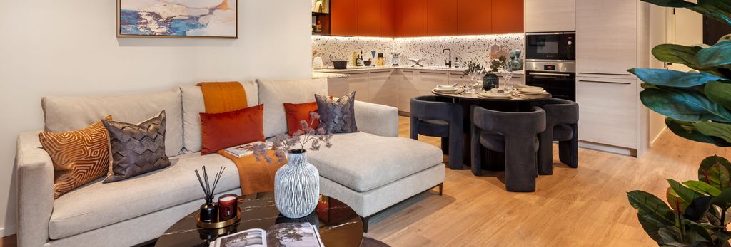 Property photo 1 of 5 Living Space With Fabric Sofa, Coffee Table, Wall Hangings, Dining Table.