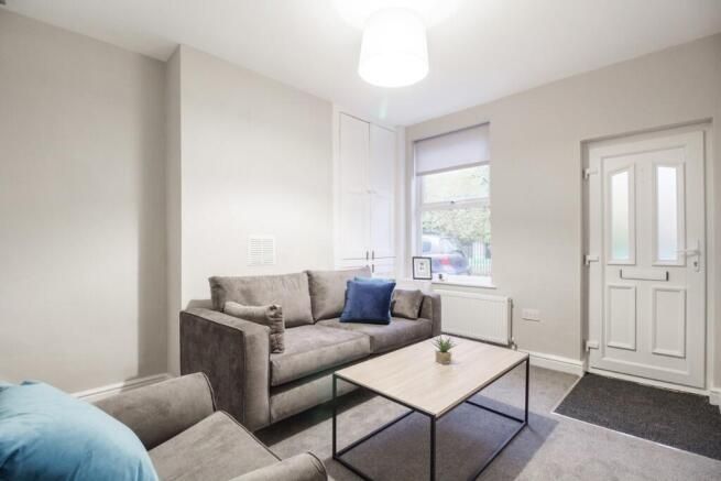 Property photo 2 of 10 Bright And Welcoming Living Room With Comfortable ...