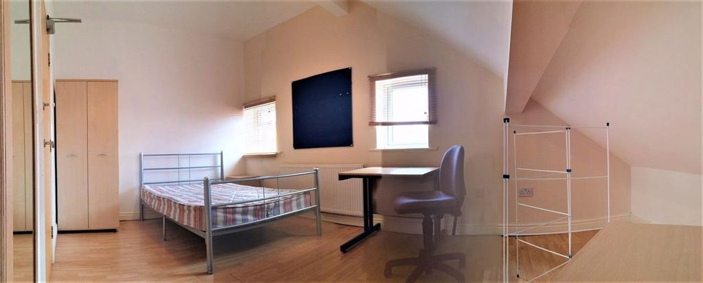 Property photo 3 of 15 A Spacious And Bright Master Bedroom Featuring A d...