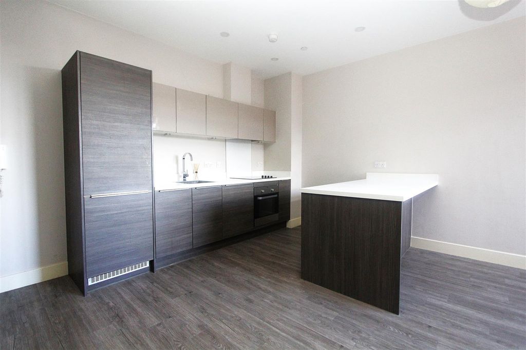 Property photo 2 of 7 Sleek Modern Kitchen With Stylish Island...