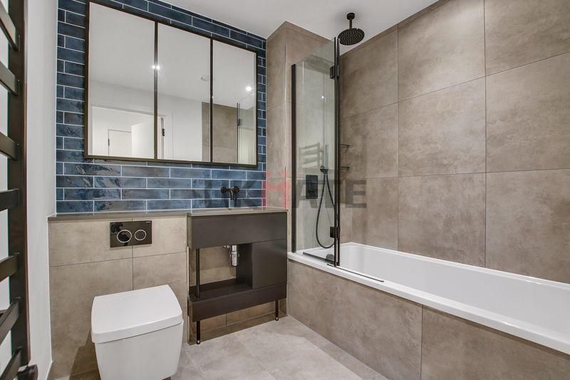 Property photo 1 of 5 Modern, Clean Bathroom Featuring A Bathtub, Walk-i...