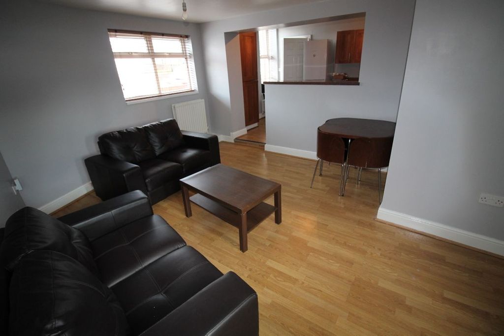 Property photo 2 of 11 A Modern Living Room Featuring Comfortable Black l...