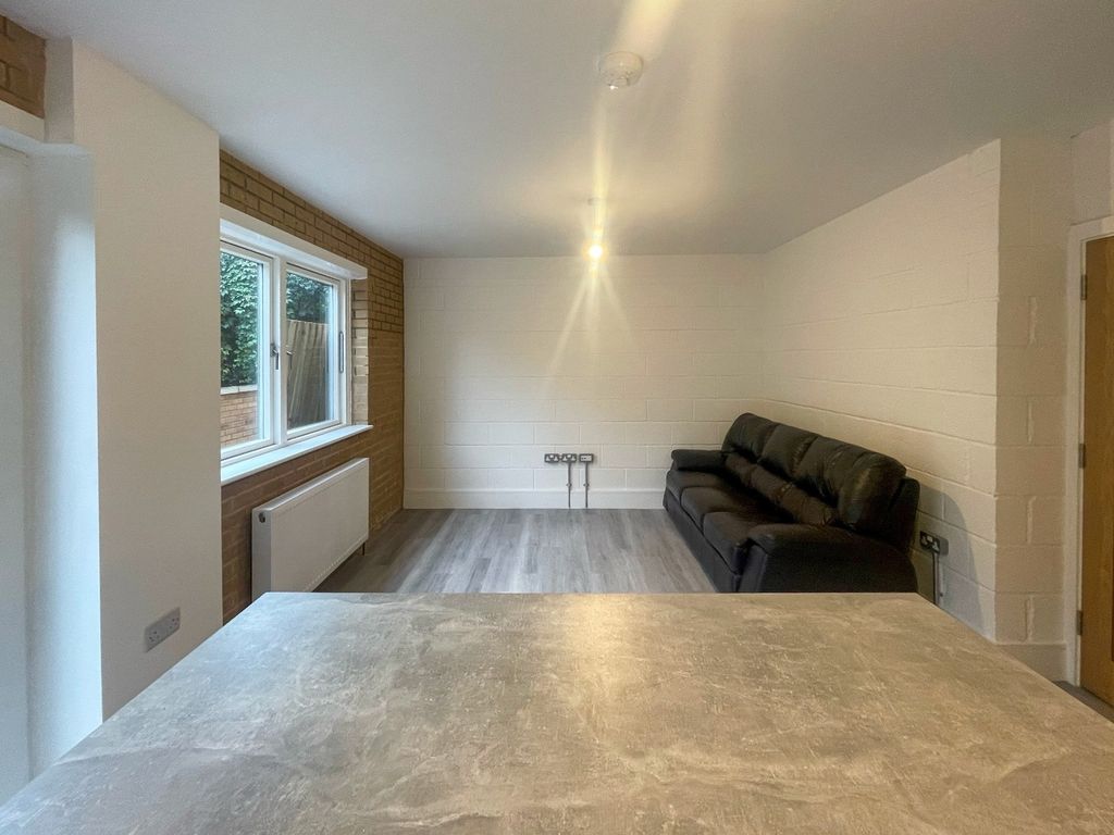 Property photo 3 of 13 Bright And Spacious Living Room Featuring Large Wi...