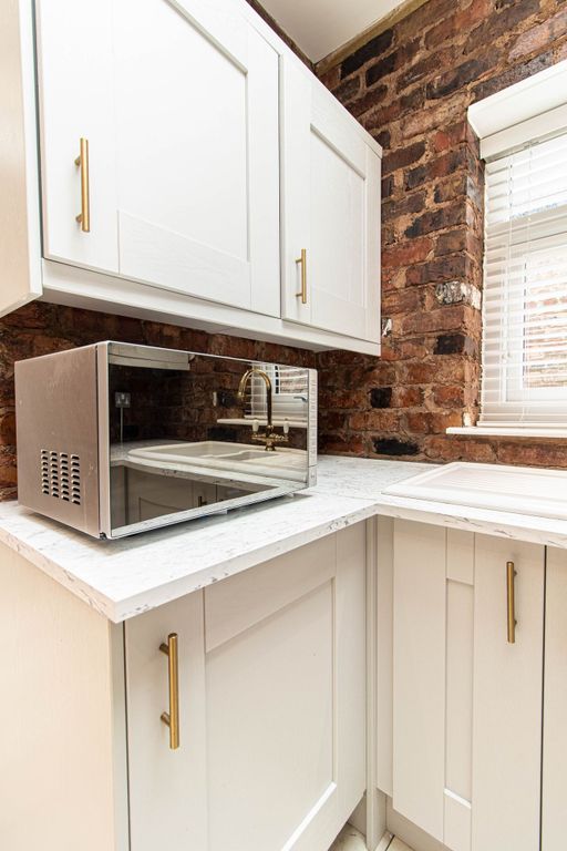 Property photo 2 of 9 Bright, Modern Kitchen Corner With White Cabinetry...