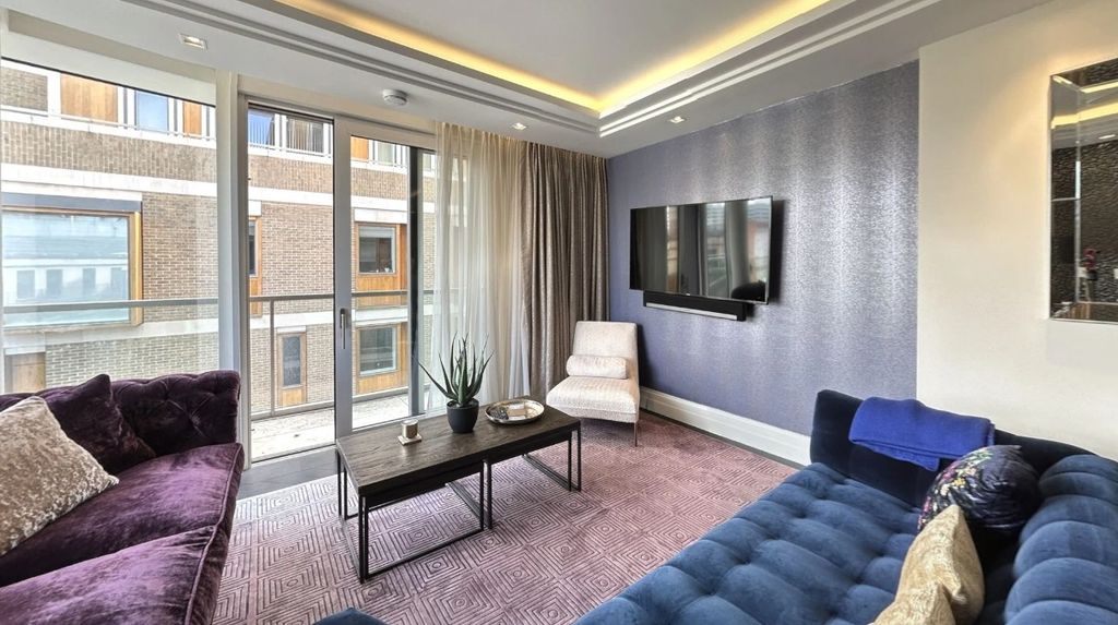 Property photo 3 of 24 A Stylish And Contemporary Living Room Featuring P...