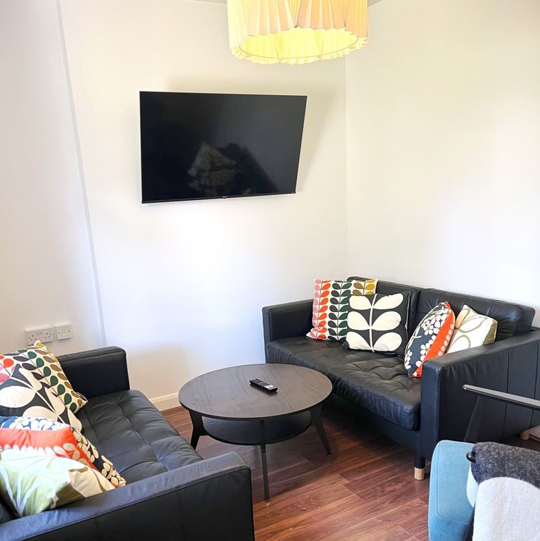 Property photo 2 of 18 Bright, Modern Lounge With Two Black Leather Sofas...