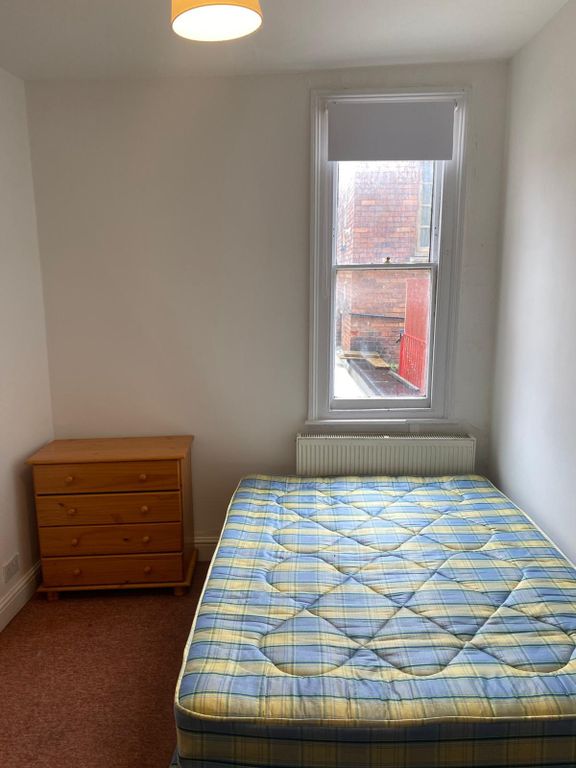 Property photo 3 of 17 A Cozy Double Bedroom Featuring A Large Window Tha...