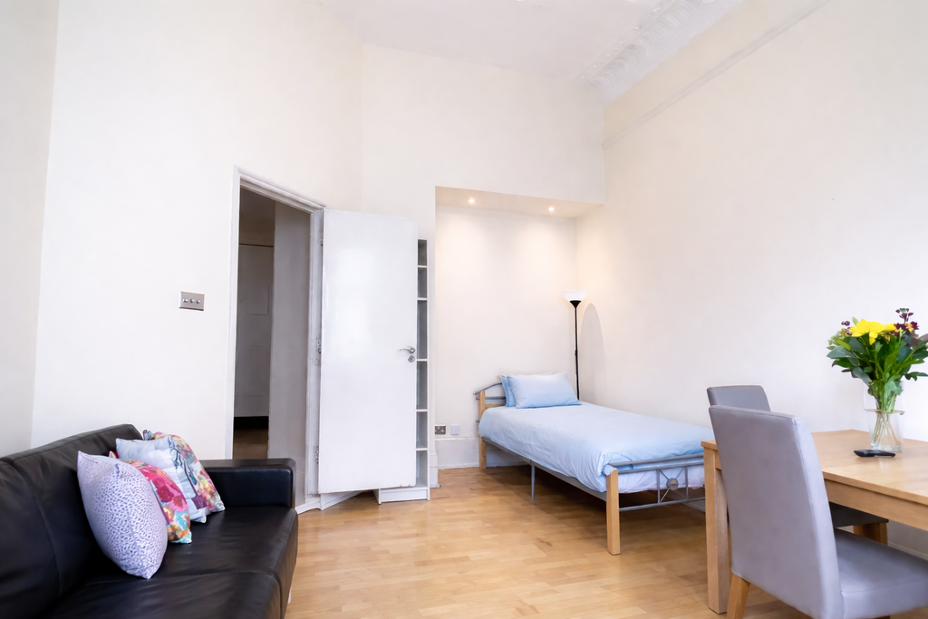 Property photo 3 of 13 Living Room W Extra Bed 