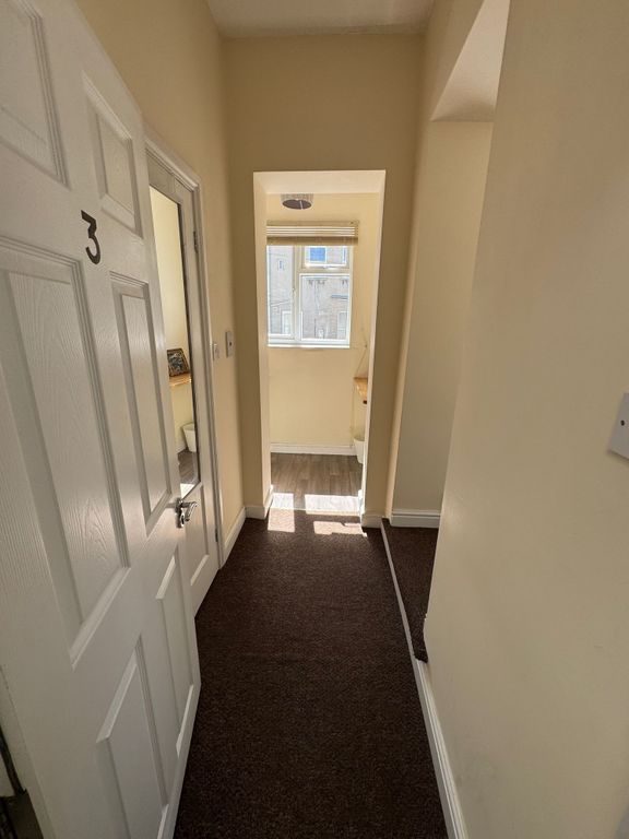 Property photo 2 of 13 Bright Hallway With Warm Carpet And Natural Light...