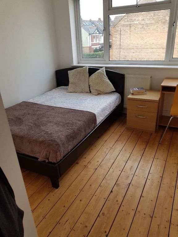Property photo 3 of 9 Bright Bedroom With Charming Wood Flooring...