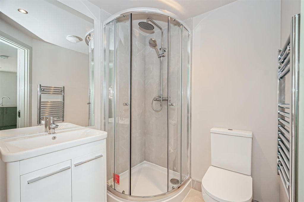 Property photo 3 of 7 Bright Modern Bathroom With A Curved Glass Shower ...