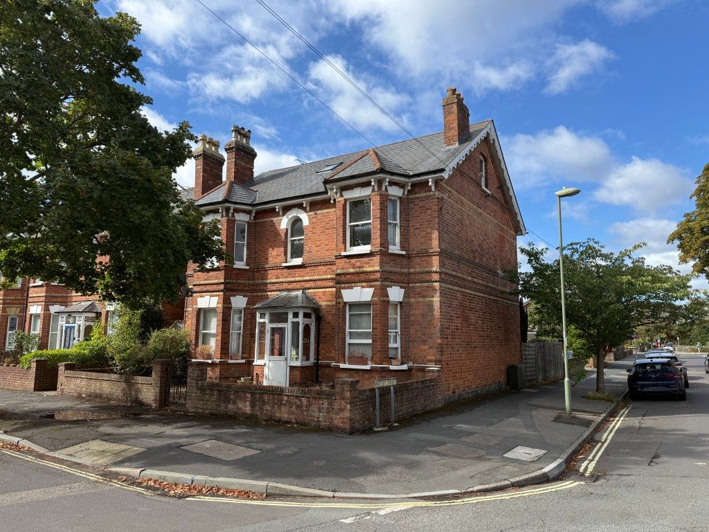 Property photo 1 of 9 Front Of Building On Corner Of Road