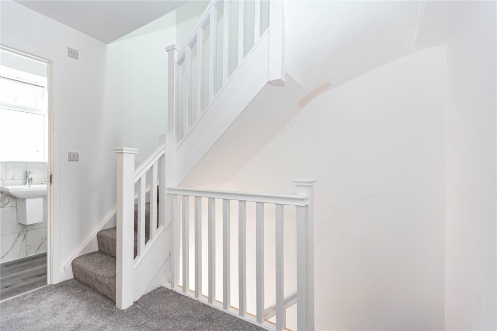 Property photo 3 of 15 Bright And Clean Staircase Area With Fresh White W...