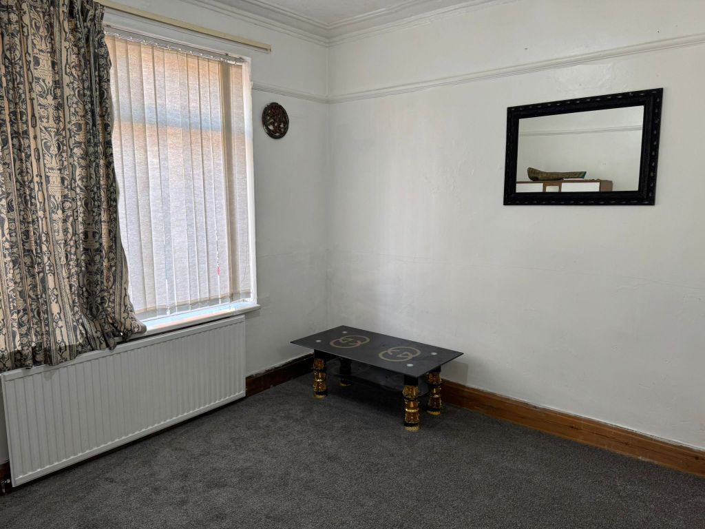 Property photo 3 of 12 Living Room 1