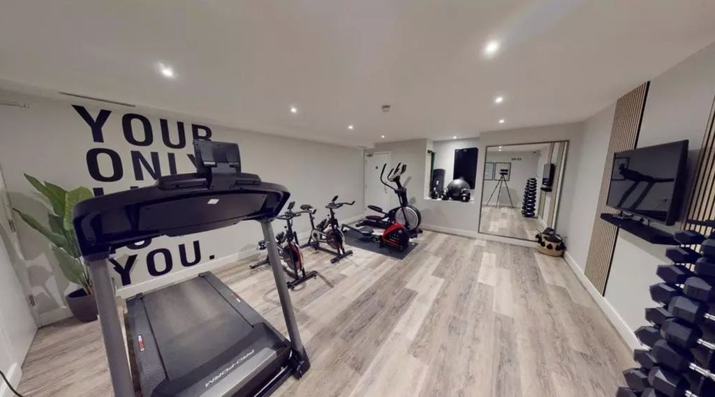 Property photo 3 of 9 A Spacious And Modern Gym Area Equipped With Vario...