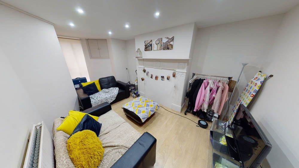 Property photo 1 of 17 A Bright And Welcoming Living Room Featuring A Com...