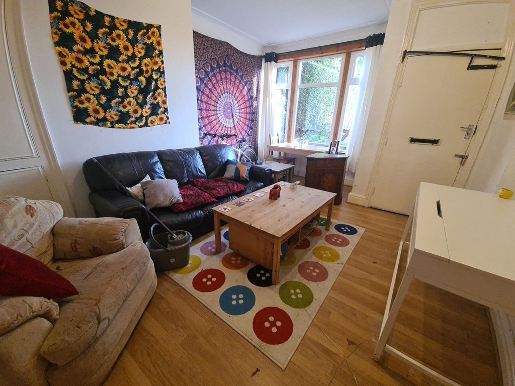 Property photo 1 of 13 A Cozy And Well-Lit Living Room Featuring A Comfor...