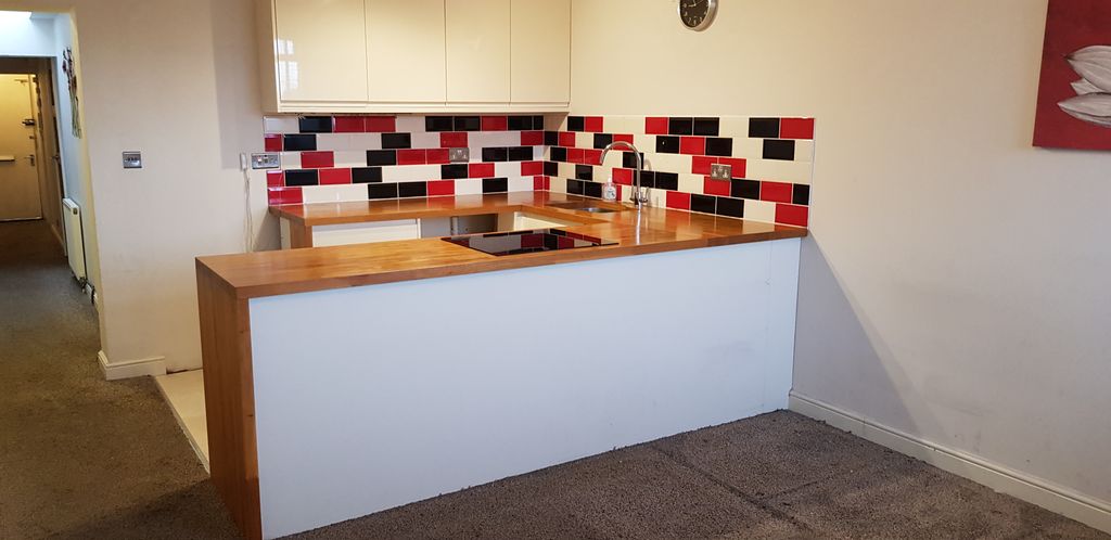 Property photo 2 of 8 Kitchen Area