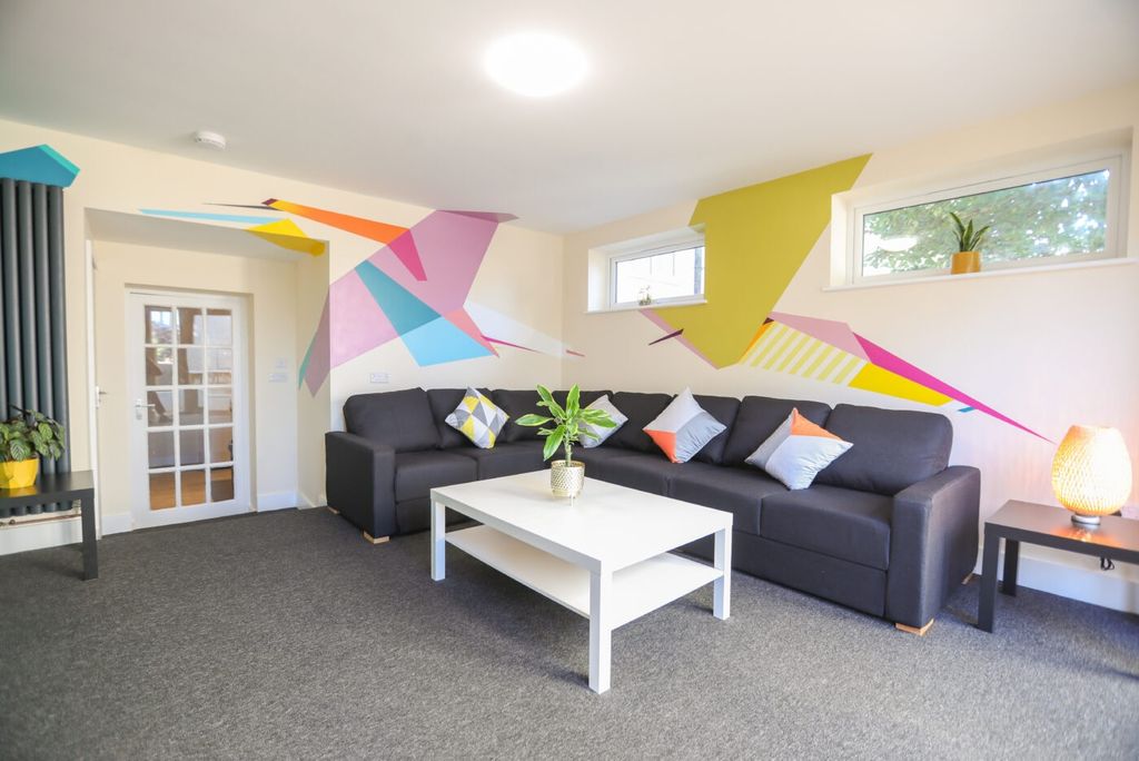 Property photo 1 of 6 Bright And Contemporary Living Room Featuring A La...