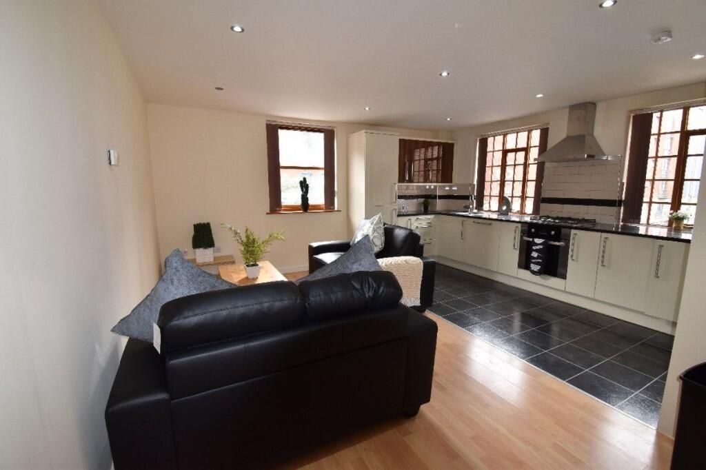 Property photo 2 of 12 A Bright And Inviting Open-Plan Living Room And Ki...