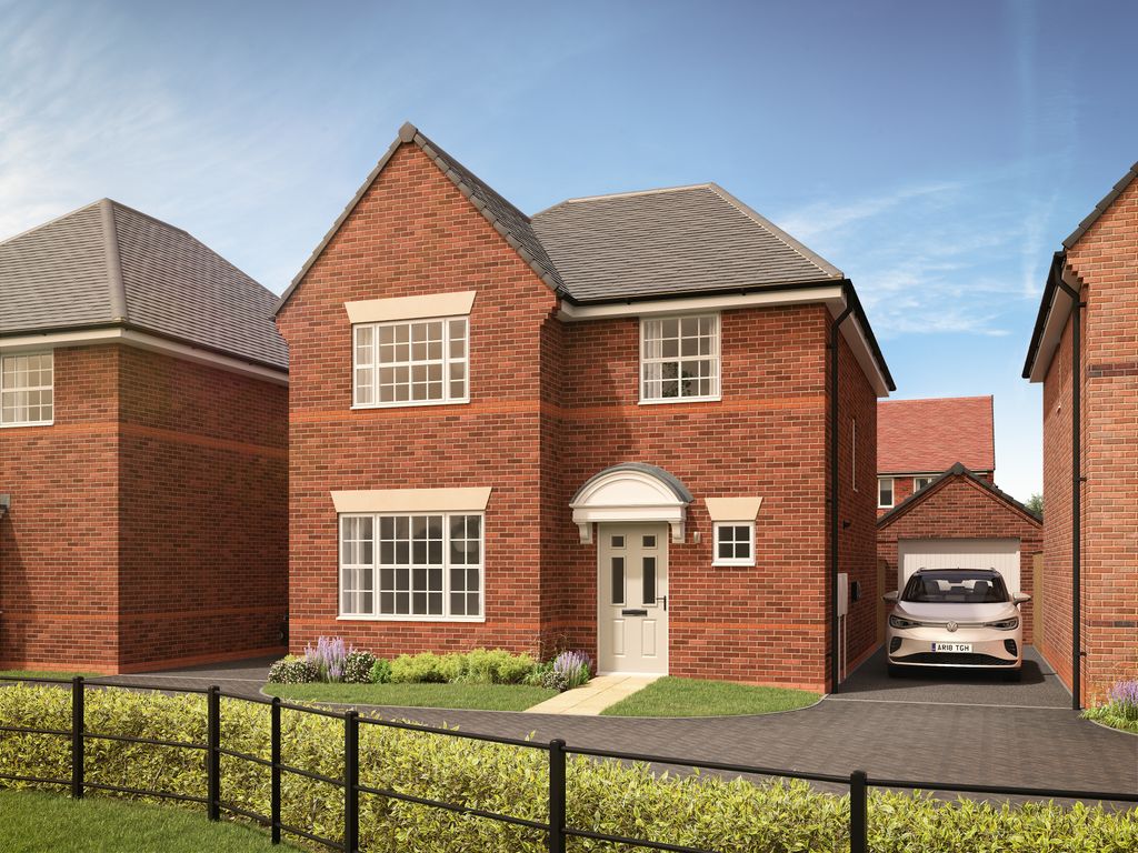 Property photo 1 of 10 A Red Brick House With A White Door And Garage Sits Behind A Black Metal Fence