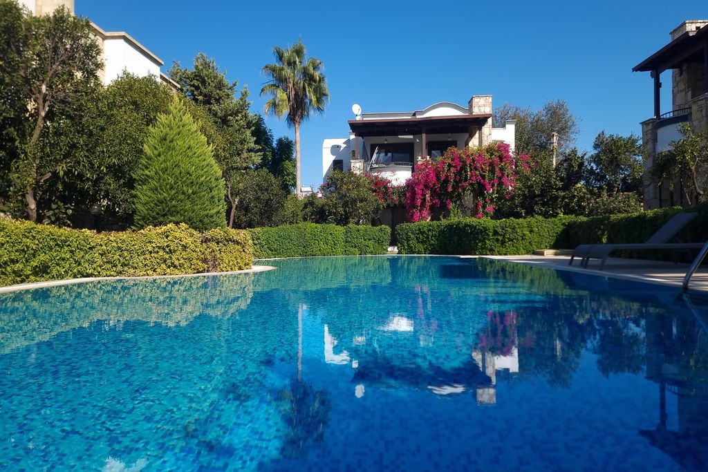 Property photo 1 of 23 Tranquil Two-Bedroom Apartment In Bodrum For Sale - Main View Of The Apartment And Pool