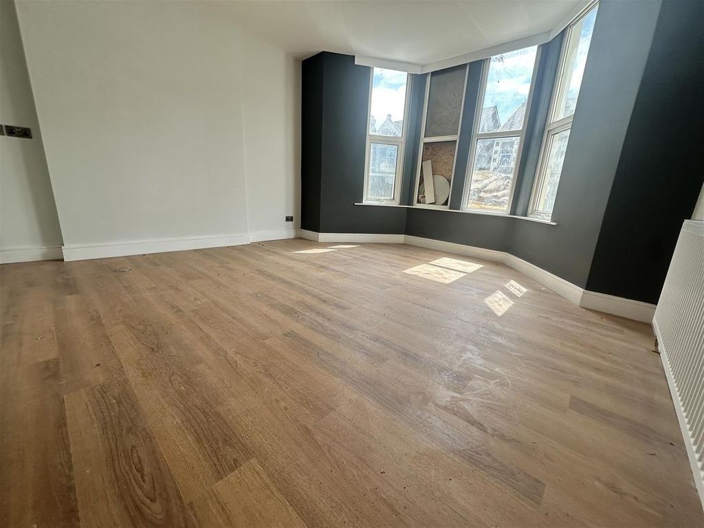 Property photo 2 of 8 Sunlit Living Room With Modern Wood Flooring...