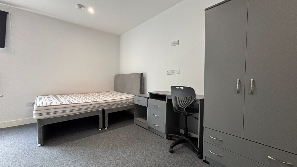Property photo 3 of 7 Bright Modern Bedroom With Ample Storage And Desk...