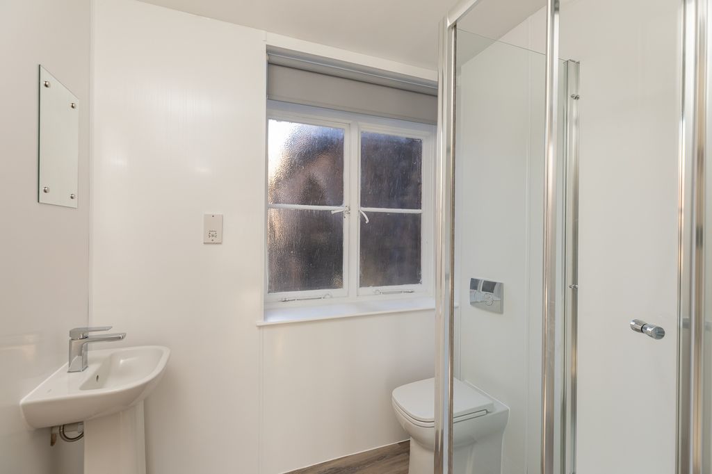 Property photo 3 of 3 A Bright And Modern Bathroom Featuring A Sleek Sho...