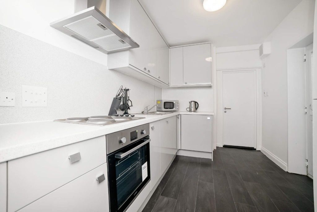 Property photo 3 of 12 Bright Modern Galley Kitchen With Integrated Oven,...