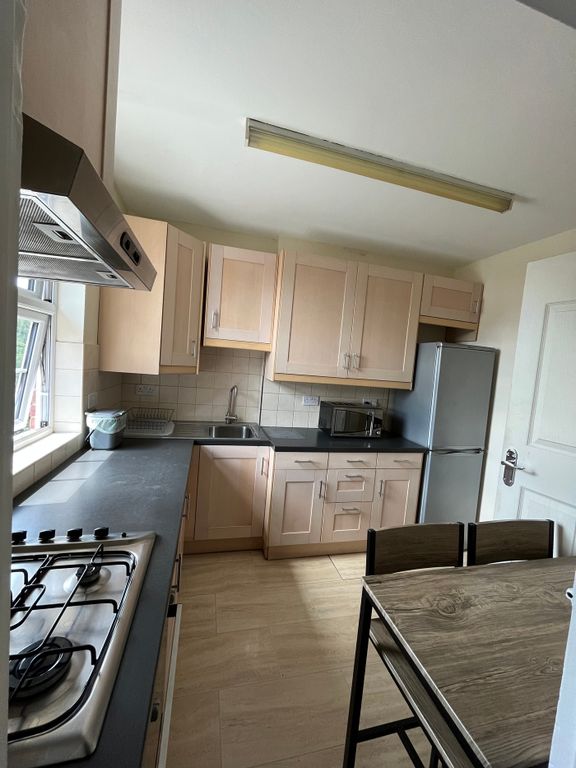 Property photo 3 of 9 This Well-Equipped Kitchen Features Modern Applian...