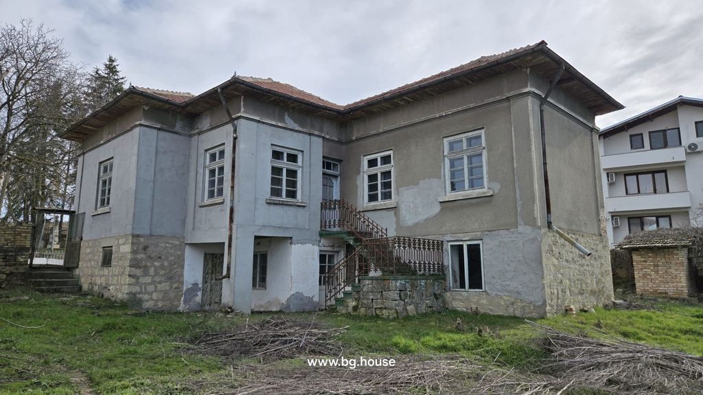 Property photo 1 of 52 Exterior View Of A Stone And Brick House Showing External Stairs And Multiple Windows In A Rural Area.