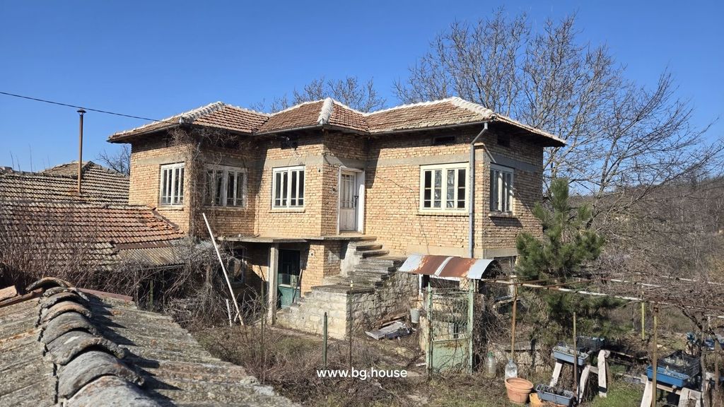 Property photo 1 of 57 Exterior View Of A Two-Storey Brick House With Tiled Roof And Stone Staircase Leading To The Upper Floor