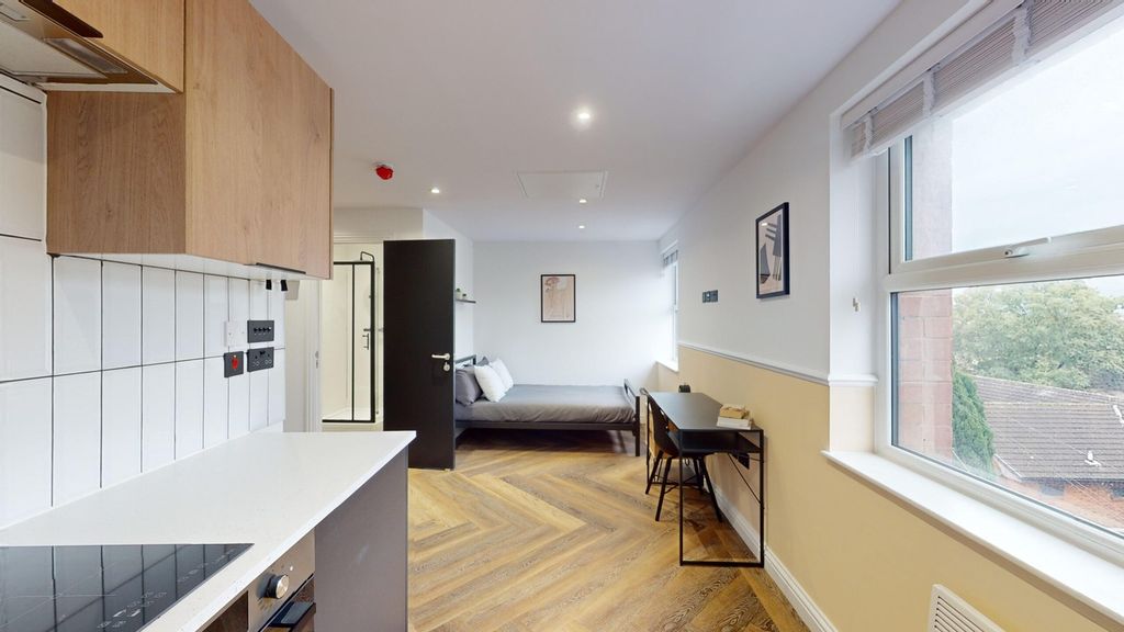 Property photo 1 of 9 A Spacious And Modern Living Room With Ample Natur...