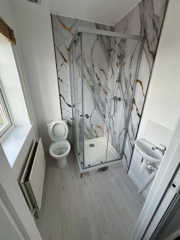 Property photo 3 of 9 Bright And Clean Bathroom Featuring A Modern Glass...